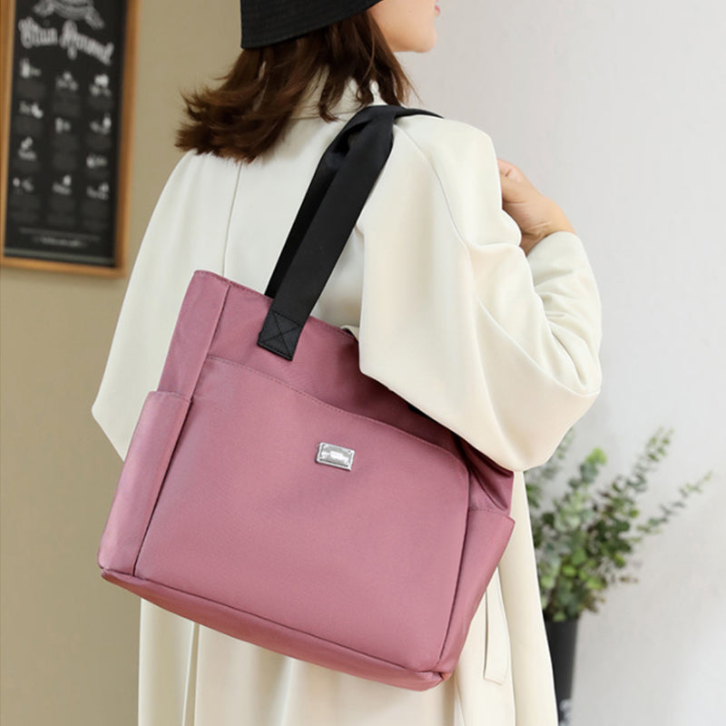 👜👜Vielseitige einfache einfarbige Nylonhandtasche mit großer Kapazität
